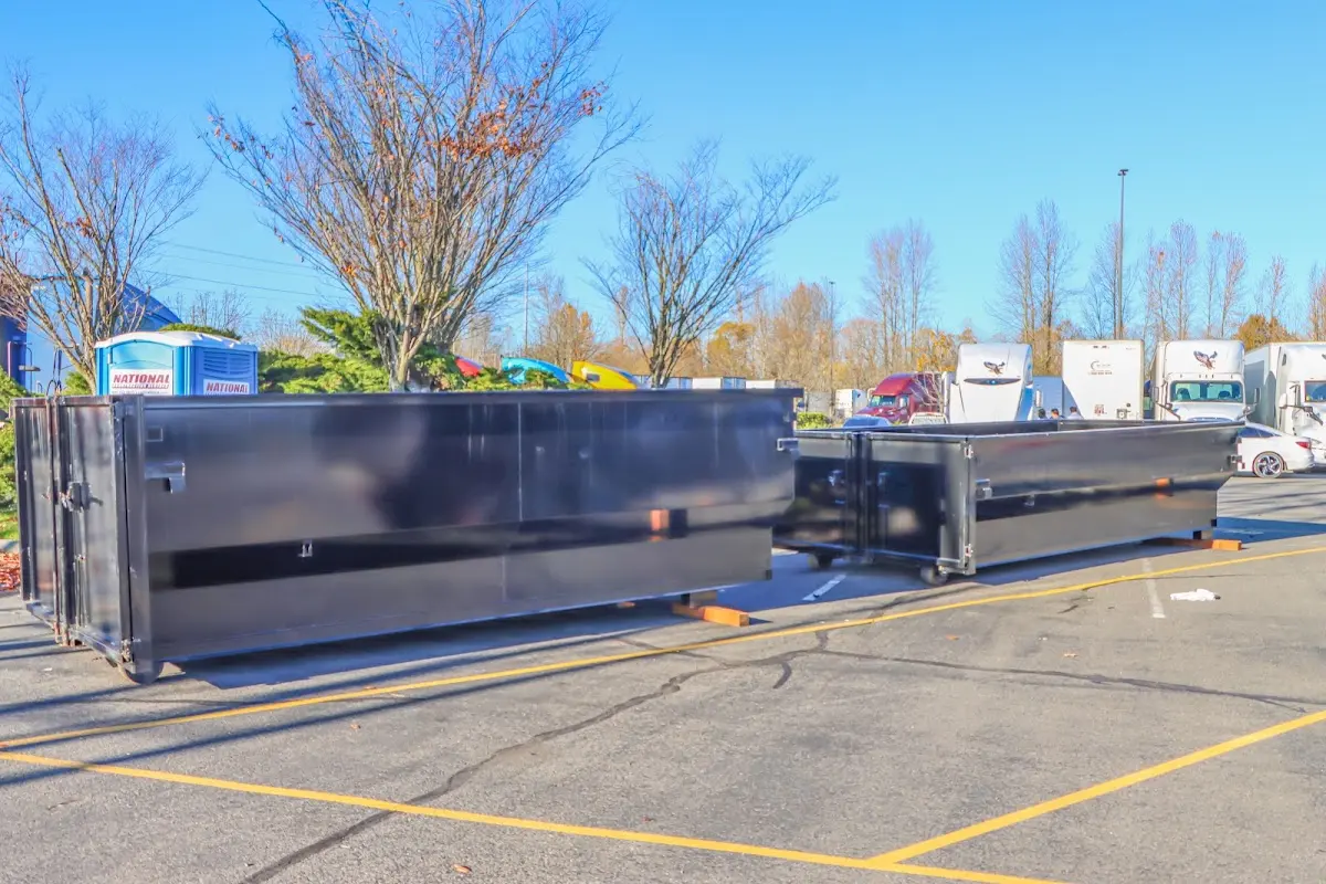 Professional dumpster rental service with roll-off container on residential driveway in Magalia